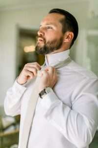 Groom getting ready at Ribault Club wedding