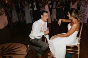 Groom getting iced at River House wedding