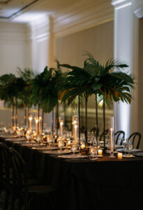 Tall tropical greenery centerpieces with candles