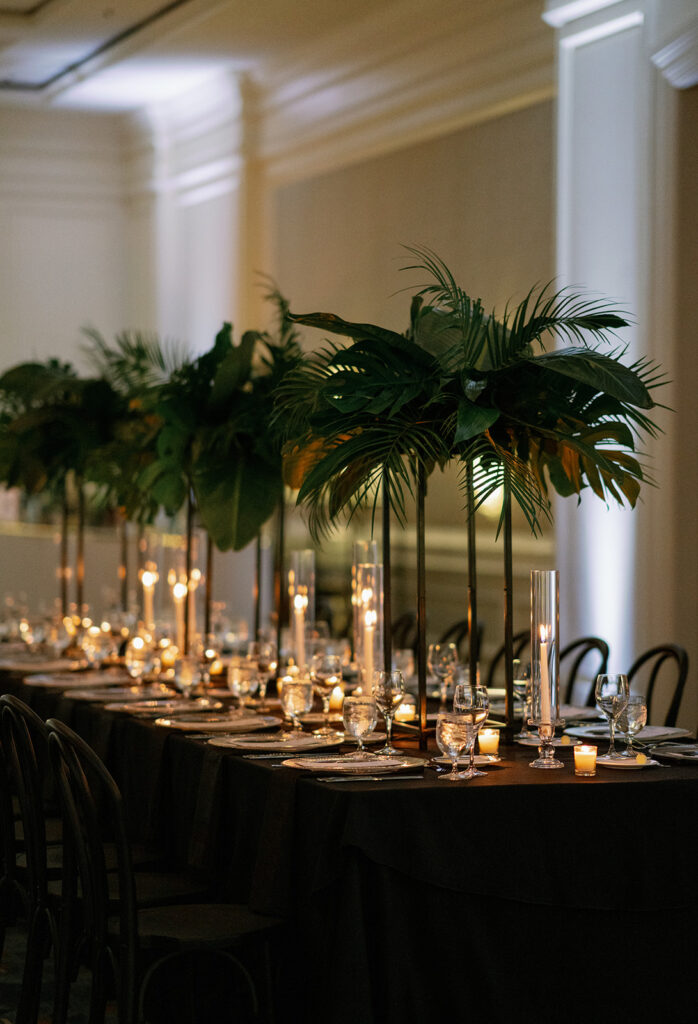 Tall tropical greenery centerpieces with candles