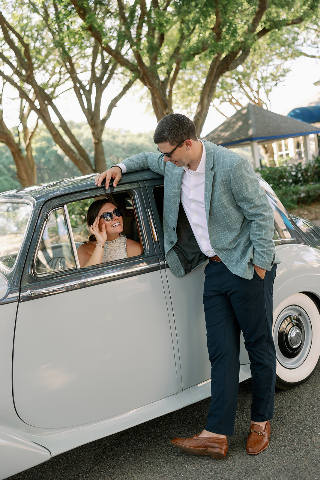 couple in vintage getaway car