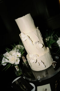 Tall, three tier modern white wedding cake